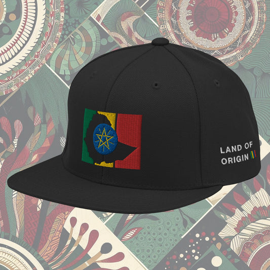 Black Ethiopia flag snapback from a Black-owned business with 'Land of Origin' on the side. Features vibrant flag colors. Perfect for showing national pride. Available now.